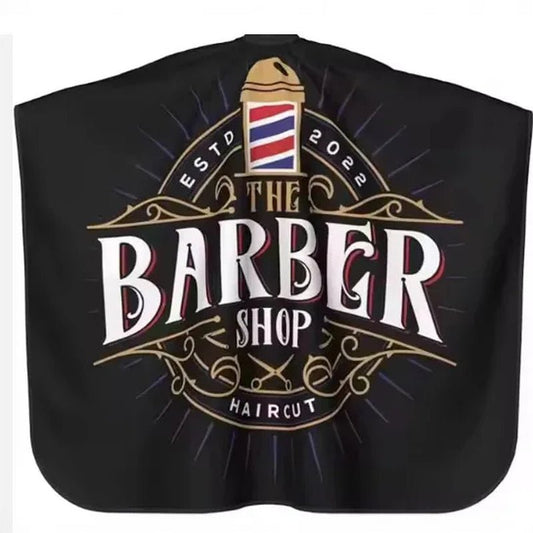 Capa de peluquería y barbería profesional Nexorretail en color negro, tela resistente, estilo vintage para cortes de cabello.
