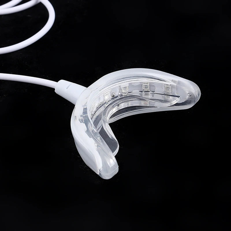 Lámpara blanqueadora de dientes Nexorretail con 16 LED y férula dental portátil conectada por USB.
