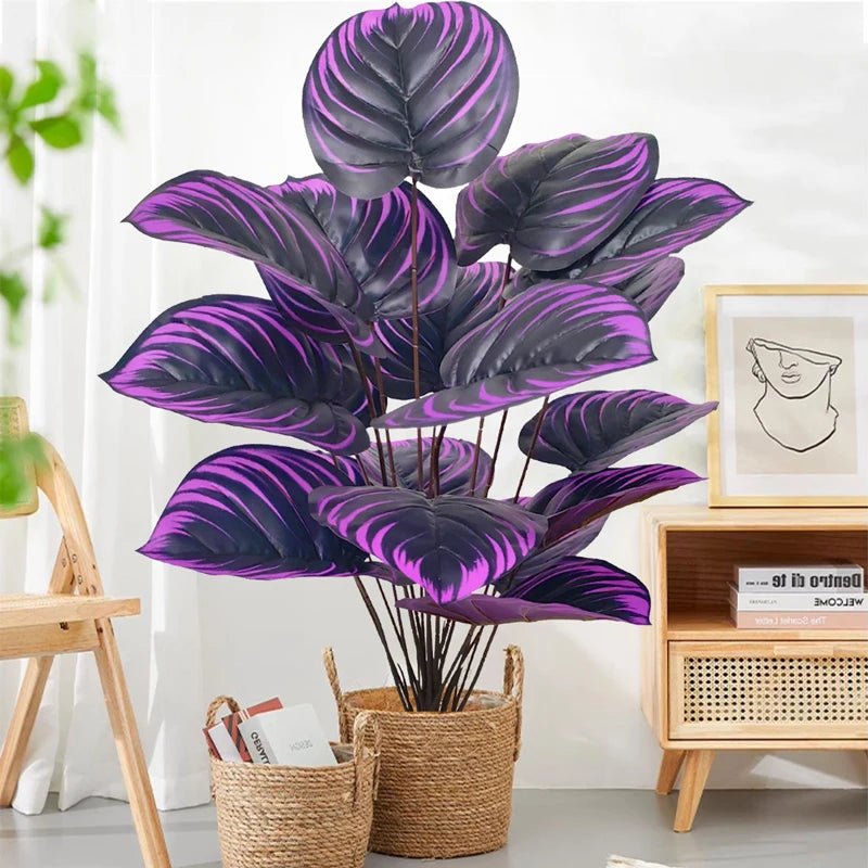 Planta artificial Monstera exótica con hojas violetas y negras, de 57 cm, para decoración de hogar o jardín, de marca Nexorretail.