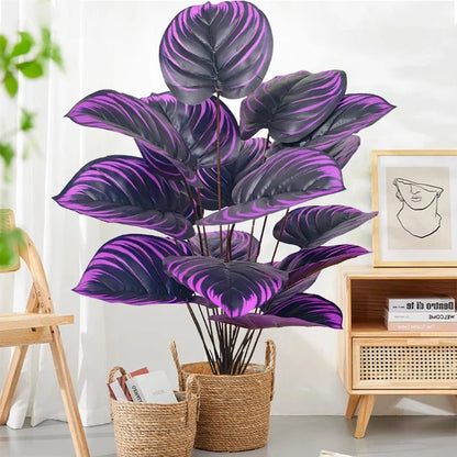 Planta artificial Monstera exótica con hojas violetas y negras, de 57 cm, para decoración de hogar o jardín, de marca Nexorretail.