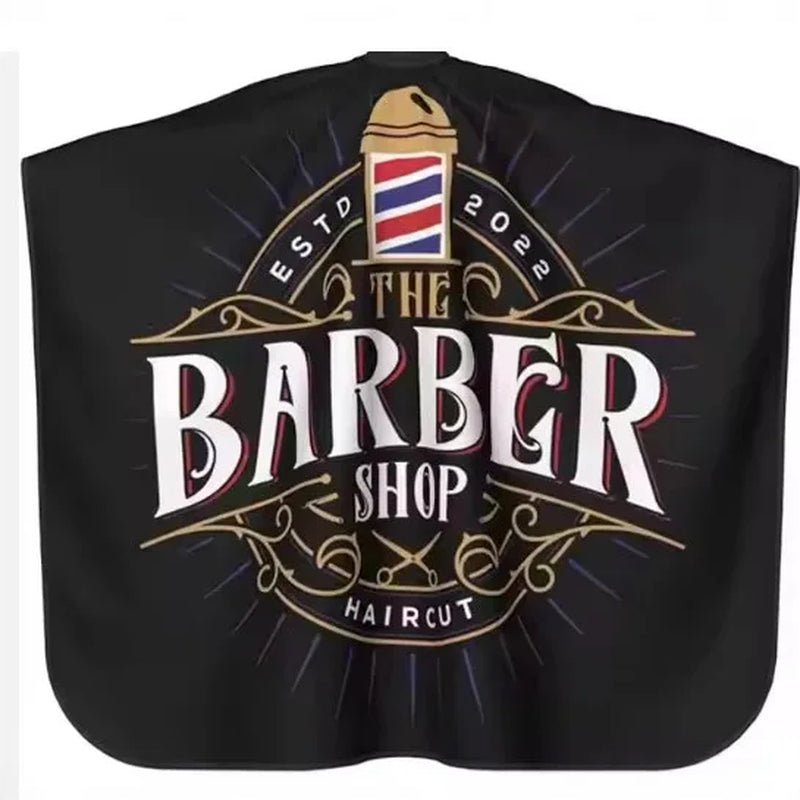 Capa de peluquería y barbería profesional Nexorretail en color negro, tela resistente, estilo vintage para cortes de cabello.