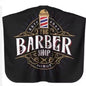 Capa de peluquería y barbería profesional Nexorretail en color negro, tela resistente, estilo vintage para cortes de cabello.