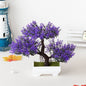Bonsái artificial en maceta de Nexorretail, árbol pequeño decorativo para hogar y jardín, con follaje verde y maceta negra.