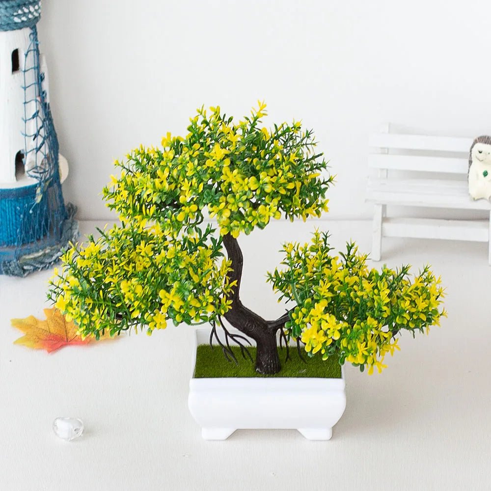 Bonsái artificial en maceta, árbol decorativo pequeño para hogar y jardín, con follaje verde y maceta negra.