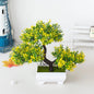 Bonsái artificial en maceta, árbol decorativo pequeño para hogar y jardín, con follaje verde y maceta negra.